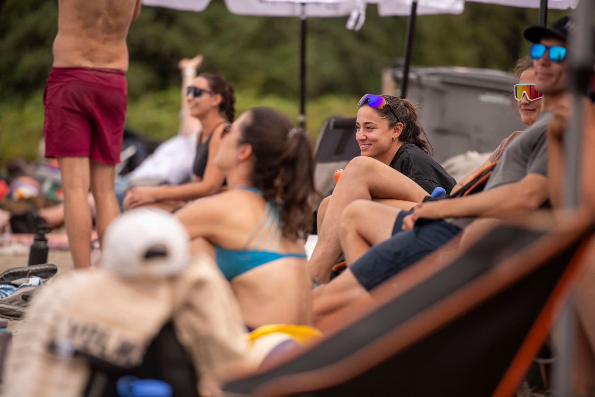 Group of beach volleyball players smiling together